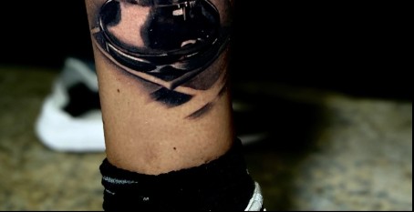 Geometric blackwork leg tattoo