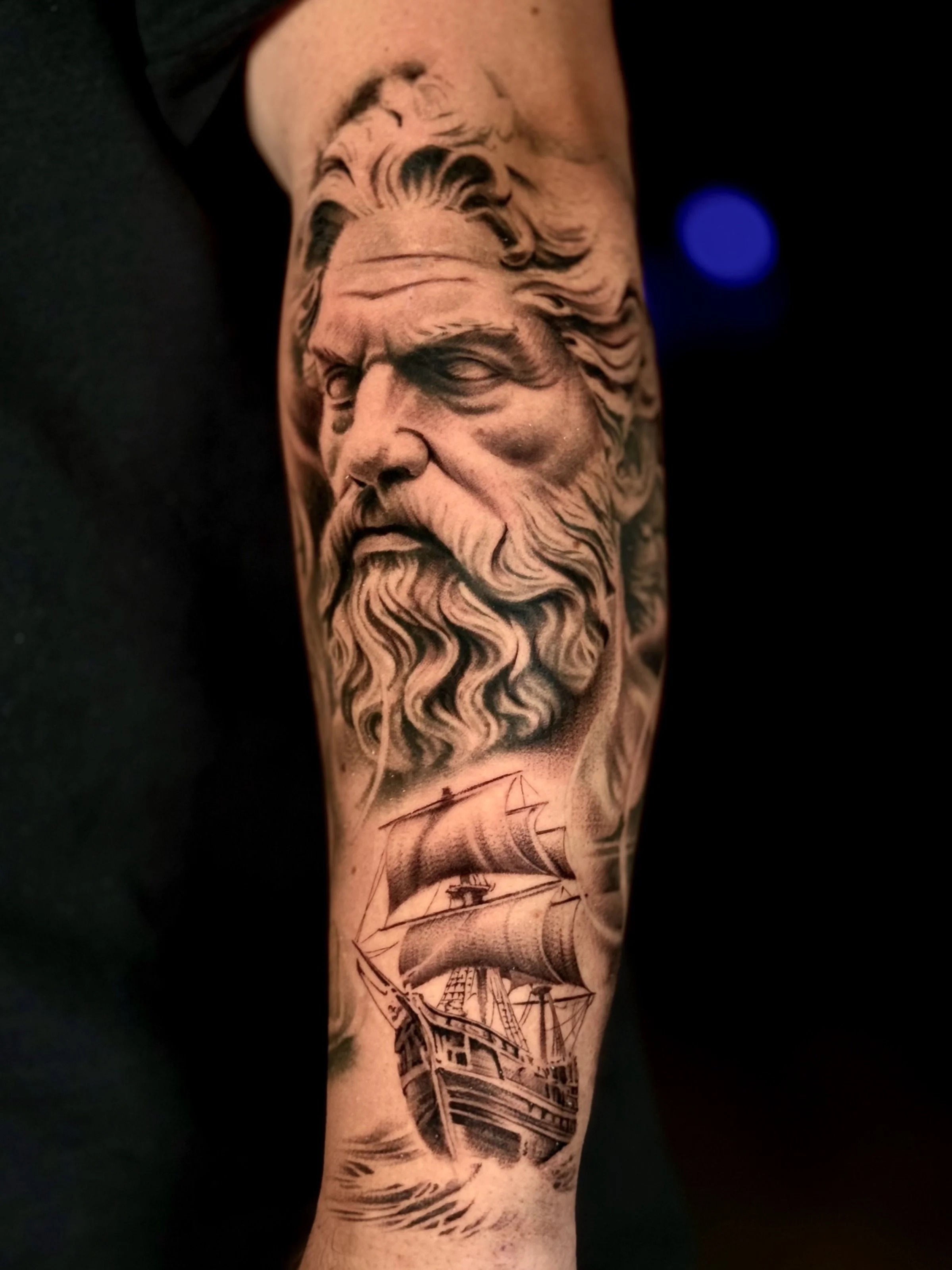 Poseidon and ship large-scale tattoo
